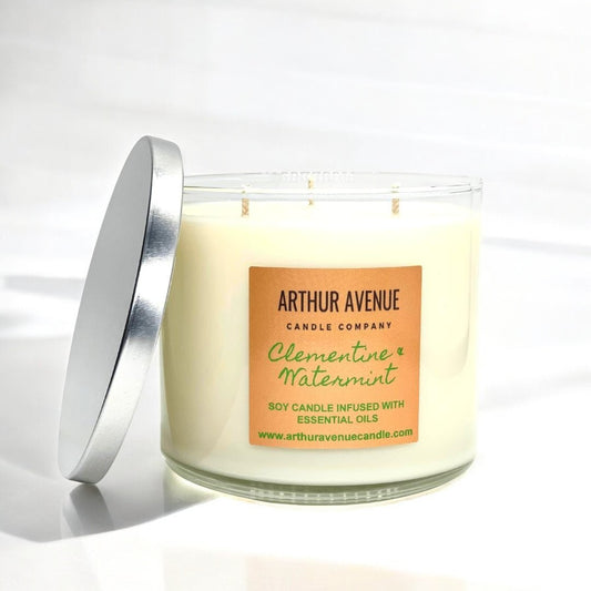 clementine and watermint soy 3-wick candle. Free from synthetic additives, dyes, phthalates, and petroleum. Organic cotton wicks.