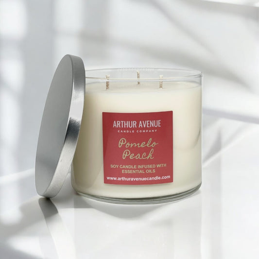 pomelo peach soy 3-wick candle. Free from synthetic additves, dyes, phthalates, and petroleum. Organic cotton wicks.