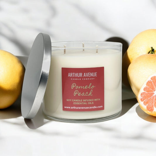 pomelo peach soy 3-wick candle. Free from synthetic additves, dyes, phthalates, and petroleum. Organic cotton wicks.